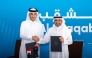 QIIB Deputy CEO Jamal Abdullah Al-Jamal and Al Shaqab Deputy CEO Khalid Al Hitmi pose for a photo after signing the agreement. 