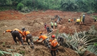Rescuers search for survivors after a landslide buried some houses in Cibeunying village, Cilacap regency, Central Java, on November 14, 2025. Photo by Bakhtiar Rahman/ AFP