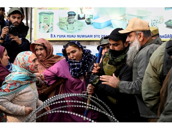 Relatives of the victims who died in an accidental blast at Nowgam police station, scuffle with security personnel whilst demanding bodies of the deceased, on the outskirts of Srinagar, on November 15, 2025. (Photo by Tauseef MUSTAFA / AFP)
 
