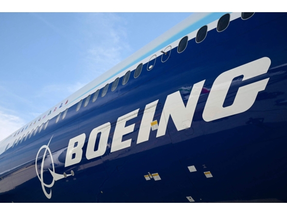 A Boeing 777-9 sits on the tarmac at Al-Maktoum International Airport during the Dubai Airshow 2025 in Dubai on November 17, 2025. (Photo by Giuseppe Cacace / AFP)