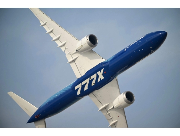 File photo: A Boeing 777-9 prepares to land at Al-Maktoum International Airport during the Dubai Airshow 2025 in Dubai on November 17, 2025. 