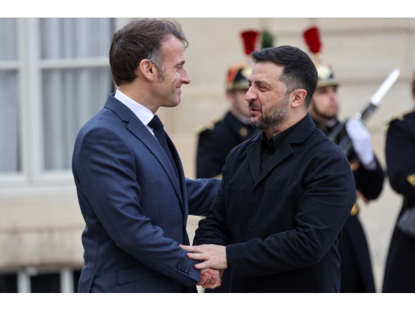 France's President Emmanuel Macron welcomes Ukraine's President Volodymyr Zelensky before their meeting at the Elysee Palace in Paris on November 17, 2025. (Photo by Ludovic MARIN / AFP)