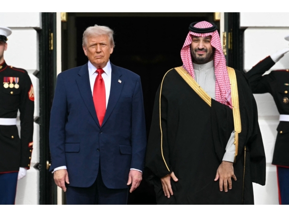 US President Donald Trump greets Crown Prince and Prime Minister of the Kingdom of Saudi Arabia Mohammed bin Salman on the South Lawn at the White House in Washington, DC on November 18, 2025. Photo by Saul Loeb / AFP