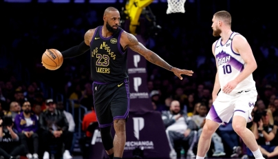 LeBron James #23 of the Los Angeles Lakers dribbles the ball against Svi Mykhailiuk #10 of the Utah Jazz during the second half on November 18, 2025 in Los Angeles, California. Ronald Martinez/Getty Images/AFP 
