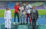 Qatar's Abubaker Haydar (right) celebrates with the gold and silver medal winners on the podium.