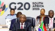 South Africa's President Cyril Ramaphosa gives the opening speech as he chairs the G20 Leaders' Summit plenary session at the Nasrec Expo Centre in Johannesburg on November 22, 2025. (Photo by Thomas Mukoya / POOL / AFP)