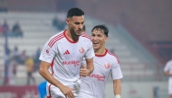 Al Shamal's Mohamed Al-Mannai (left) celebrates with teammate Omar Rafik Mohamed.