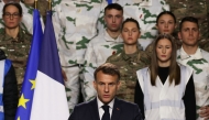 France's President Emmanuel Macron (C) delivers a speech to unveil a new national military service at the military base in Varces, French Alps, on November 27, 2025. (Photo by Thomas Padilla / Pool / AFP)
 