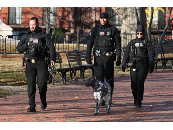 Secret Service uniformed division officers patrol in Lafayette Square across from the White House, in Washington, DC on November 27, 2025. Two National Guard troops were shot November 26 in a 