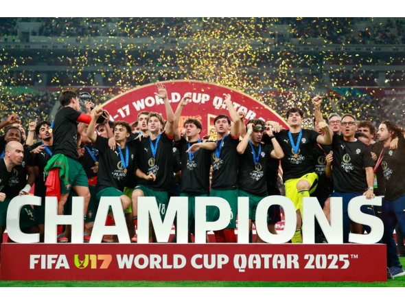 AFP photo of Portugal's players celebrate with the trophy on the podium after the FIFA U17 World Cup final football match between Portugal and Austria at Khalifa International Stadium in Al-Rayyan on November 27, 2025.