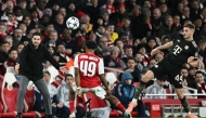 Arsenal's Spanish manager Mikel Arteta (L) shouts at Arsenal's English midfielder #49 Myles Lewis-Skelly during the UEFA Champions League league phase football match between Arsenal and Bayern Munich at the Emirates Stadium in north London on November 26, 2025. (Photo by Ben STANSALL / AFP)