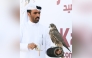 Participant with his falcon during the competition.