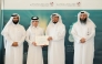 Assistant Undersecretary for Dawah and Mosque Affairs Mohammed bin Hamad Al Kuwar honouring a winner at a ceremony.
