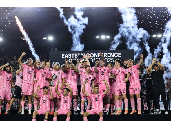Lionel Messi #10 of Inter Miami CF and teammates lift the Champion's trophy after winning the the Audi 2025 MLS Cup western conference final match between Inter Miami CF and New York City FC at Chase Stadium on November 29, 2025 in Fort Lauderdale, Florida. Carmen Mandato/Getty Images/AFP
