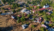 An aerial view shows flood damage in Meureudu, Pidie Jaya district in Indonesia's Aceh province on November 30, 2025. (Photo by CHAIDEER MAHYUDDIN / AFP)
