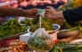 File photo: A customer buys vegetables from a stall at a market in Karachi on July 3, 2023. (Photo by Asif HASSAN / AFP)