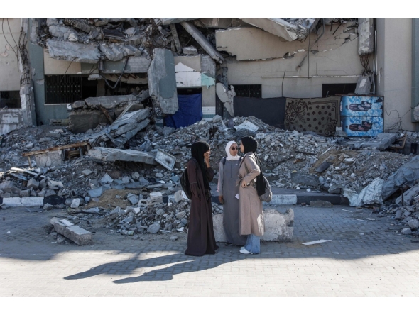 Students interact at the Islamic University after the resumption of classes during a ceasefire between Israel and Hamas in Gaza City, on December 2, 2025. (Photo by Omar AL-QATTAA / AFP)