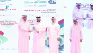 Chairman of the Board of Directors of Dar Al Sharq Group Sheikh Dr. Khalid bin Thani bin Abdullah Al Thani (left) honouring a participant, while CEO of Dar Al Sharq Group Abdul Latif Abdullah Al Mahmoud and Deputy CEO of Dar Al Sharq Group and Editor-in-Chief of Al Sharq Jaber Al Harami look on.  Pic: Rajan Vadakkemuriyil/The Peninsula