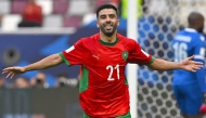 Morocco’s Karim El Berkaoui celebrates after scoring his team’s third goal. 