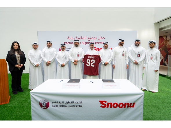 QFA and Snoonu officials during the signing ceremony.