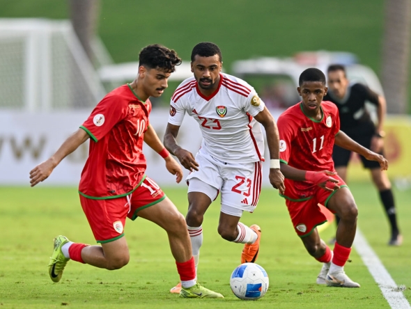 Action during the match between UAE and Oman.