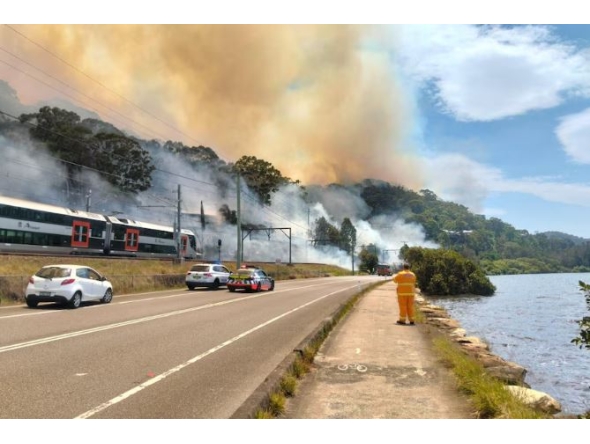Trains have stopped running on the Central Coast and Newcastle line after a fire broke out on Nimbin Road at Koolewong. (Pics: ABC News)