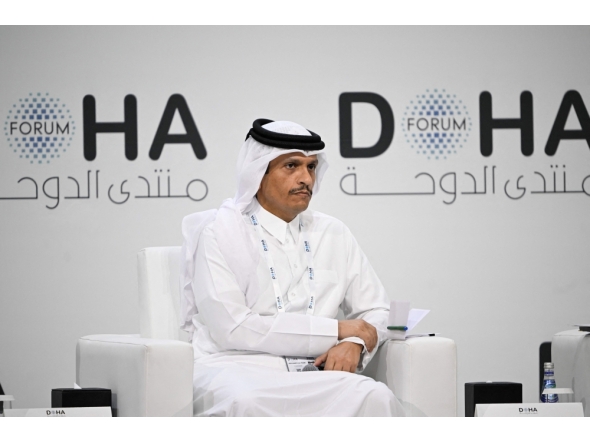 Qatar's Prime Minister and Minister for Foreign Affairs Sheikh Mohammed bin Abdulrahman bin Jassim Al-Thani, attends a session on the opening day of the Doha Forum, an annual diplomatic conference, in Doha on December 6, 2025. (Photo by Mahmud Hams / AFP)