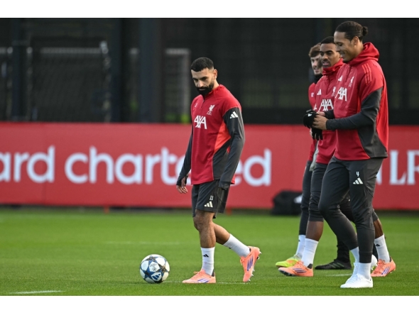 Liverpool's Egyptian striker #11 Mohamed Salah (C) attends a team training session at their training ground in Kirkby, Liverpool on December 8, 2025. (Photo by Paul Ellis / AFP)