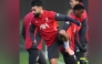 Liverpool’s Mohamed Salah (left) attends a team training session.