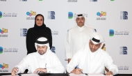 Qatar Museums Chairperson H E Sheikha Al Mayassa bint Hamad bin Khalifa Al Thani, Dukhan Bank Executive Board Member and Managing Director H E Sheikh Mohammed bin Hamad bin Jassim Al-Thani, and other officials at the signing ceremony. 
