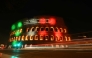 The Colosseum is illuminated and a message reads 