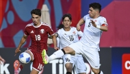 Action during the semi-final between Qatar and Iraq. 