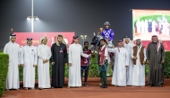 The connections of Naseeb Zakhir celebrate after the Osama Omer Al-Dafea-owned grey colt won the Zekreet Cup. PICTURES: JUHAIM/QREC