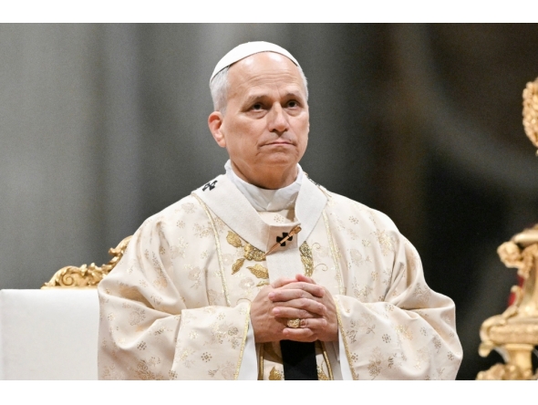 Pope Leo XIV performs the Christmas mass at St Peter's Basilica in the Vatican on December 25, 2025. (Photo by Tiziana Fabi / AFP)