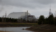 This photograph shows the containment vessel of the New Safe Confinement (NSC) which contains radiation from the remains of reactor 4 of the former Chernobyl Nuclear Power Plant, in Chernobyl, on December 22, 2025, amid the Russian invasion of Ukraine. Photo by Tetiana Dzhafarova / AFP
