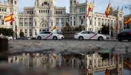 File: A picture taken on October 31, 2024 shows the Spanish flag flying at half-mast at the start of three days of national mourning after Spain's deadliest floods in decades, at Cibeles Square in Madrid. (Photo by Oscar Del Pozo / AFP)