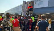 Mexican Army soldiers and Civil Protection members rescued passengers from the Interoceanic train that derailed in the Asuncion Ixtaltepec area on the route to Oaxaca, Mexico on December 28, 2025. (Photo by Rusvel Rasgado / AFP)