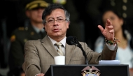 Colombia's President Gustavo Petro delivers a speech during the commemoration of the 134th anniversary of the National Police and the promotion of officers at the General Santander Police Academy in Bogota on November 13, 2025. (Photo by Raul Arboleda/ AFP)
