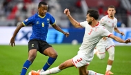 Tanzania’s Feisal Salum (left) and Tunisia’s Montassar Omar Talbi vie for the ball. 