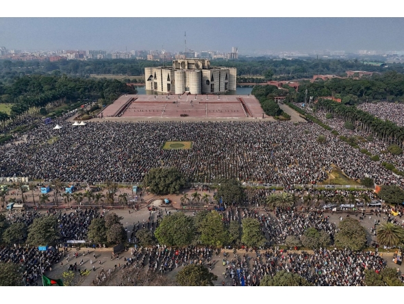 An aerial view shows mourners gathered for the funeral ceremony of Bangladesh's former prime minister Khaleda Zia at the Parliament House premises in Dhaka on December 31, 2025 a day after her death. Photo by S M Ariful AMIN / AFP