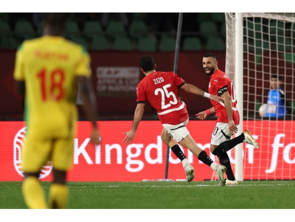 Egypt's forward #10 Mohamed Salah (R) celebrates scoring his team's third goal during the Africa Cup of Nations (CAN) round of 16 football match between Egypt and Benin at the Grand Stadium in Agadir on January 5, 2026. (Photo by FRANCK FIFE / AFP)