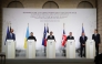 (From L) Germany's Chancellor Friedrich Merz, Ukraine's President Volodymyr Zelensky, France's President Emmanuel Macron, Britain's Prime Minister Keir Starmer, US Special Envoy Steve Witkoff and US businessman Jared Kushner deliver a press conference upon the signing of the declaration on deploying post-ceasefire force in Ukraine on January 6, 2026. (Photo by Ludovic Marin / Pool / AFP)