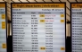 This photograph shows a flight departures information board displaying numerous cancellations at the Schiphol Airport on January 6, 2026 as hundreds of flights have been cancelled again at the airport due to snowfall. (Photo by Robin Utrecht / ANP / AFP) / Netherlands OUT