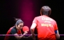 Ying Han (left) serves against Wang Manyu. 