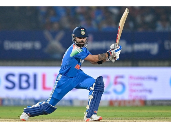 India's Virat Kohli watches the ball after playing a shot during the first one-day international (ODI) cricket match between India and New Zealand at the Kotambi Stadium in Vadodara on January 11, 2026. (Photo by Shammi MEHRA / AFP)