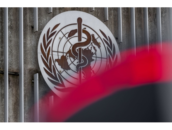 This photograph taken on April 23, 2025 shows a logo of the World Health Organisation (WHO) next to their headquarters in Geneva. Photo by Fabrice COFFRINI / AFP