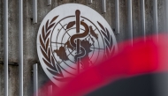 This photograph taken on April 23, 2025 shows a logo of the World Health Organisation (WHO) next to their headquarters in Geneva. Photo by Fabrice COFFRINI / AFP