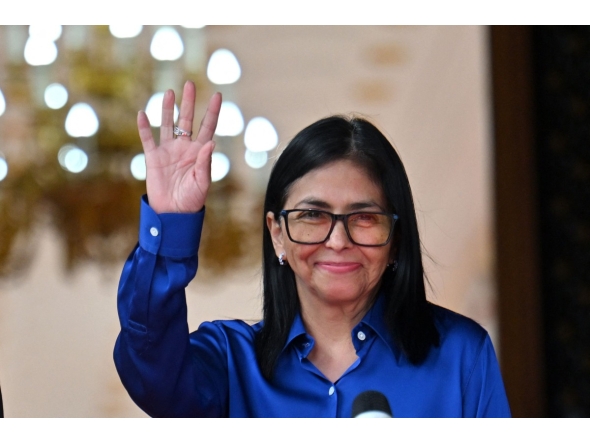 Venezuela's interim President Delcy Rodriguez waves after a press conference at the Presidential Palace in Caracas on January 14, 2026. (Photo by Juan BARRETO / AFP)
