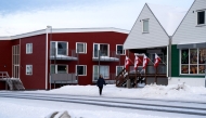 Greenlandic flags are fixed on a building in Nuuk, Greenland, on January 14, 2026.  (Photo by Alessandro Rampazzo / AFP)