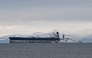 An oil tanker formerly known as the Bella-1, before it changed its name to the Marinera, is pictured alongside a US coast guard ship, at sea in the Moray Firth, northern Scotland, on January 14, 2026. (Photo by Andy Buchanan/ AFP)